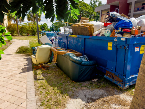 istock Dumpster full of garbages at residential garbage dump area 1600121700