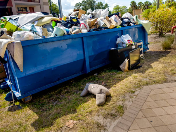 istock Dumpster full of garbages at residential garbage dump area 1600121704