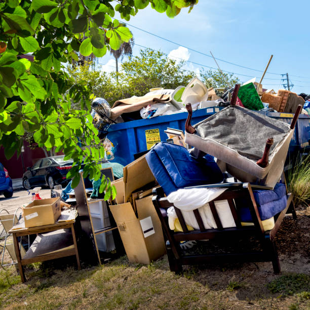 istock Dumpster full of garbages at residential garbage dump area 1600121777