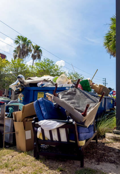istock Dumpster full of garbages at residential garbage dump area 1600121781