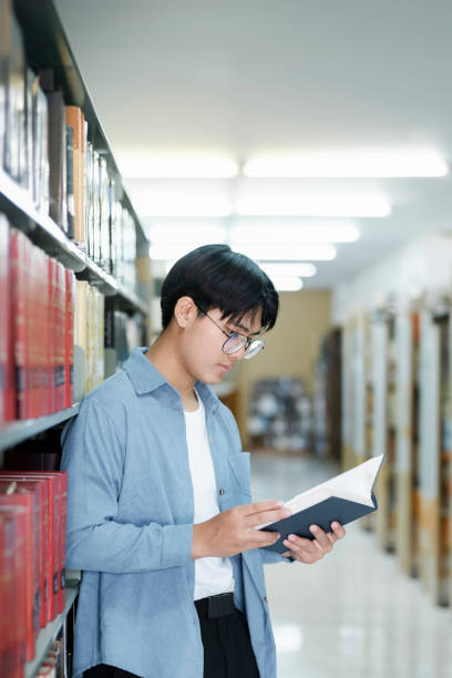 istock University students reading books in library for research. 1600121914