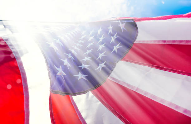 istock Close up shiny American flag with sunbeam 1600121947