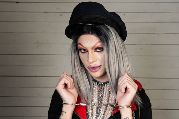 istock Drag queen in a provocative outfit poses in the studio. 1600127776