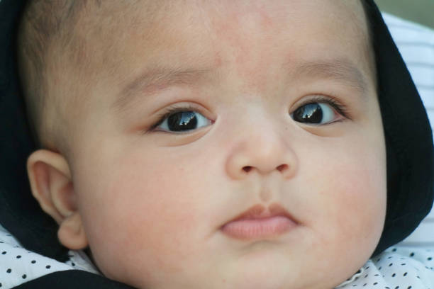 Smiling cool baby on the white backround