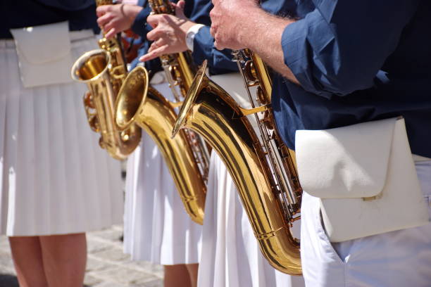 istock Midsection of brass band playing music 1600152041