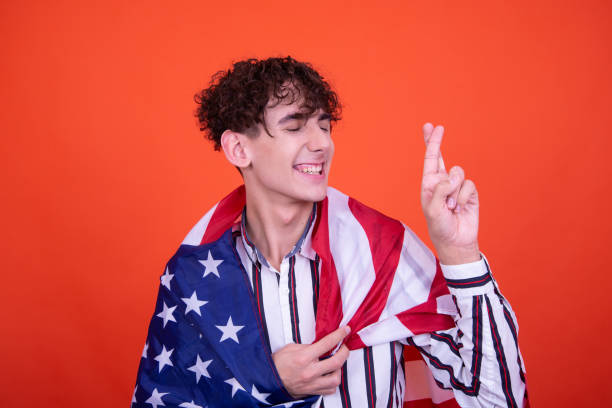 istock Young attractive guy with usa flag. 1600158832