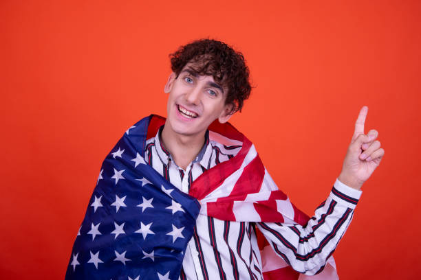 istock Young attractive guy with usa flag. 1600166659