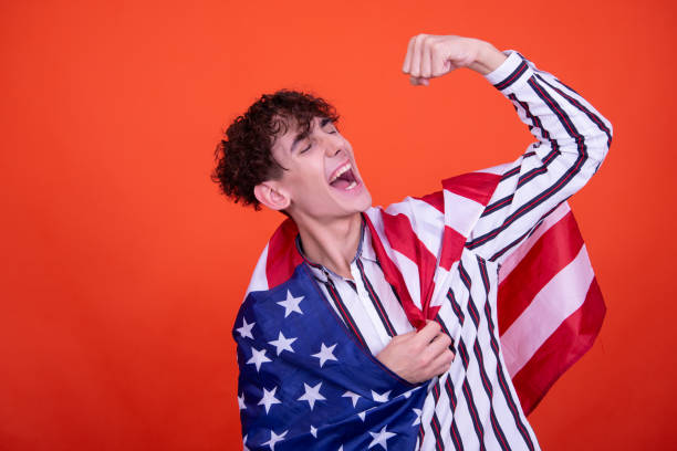 istock Young attractive guy with usa flag. 1600169276