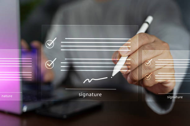 istock Electronic signature concept, business people sign electronic documents on digital documents, paperless office, future business contract signing. 1600175116