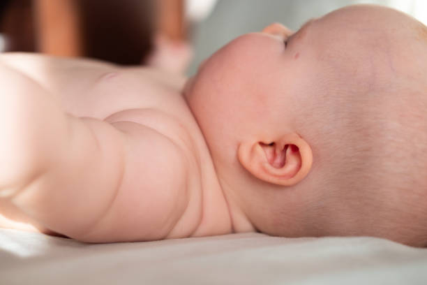 istock Little baby ears close up 1600206230