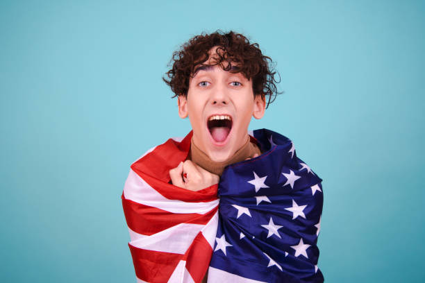istock Young attractive guy with usa flag. 1600207940