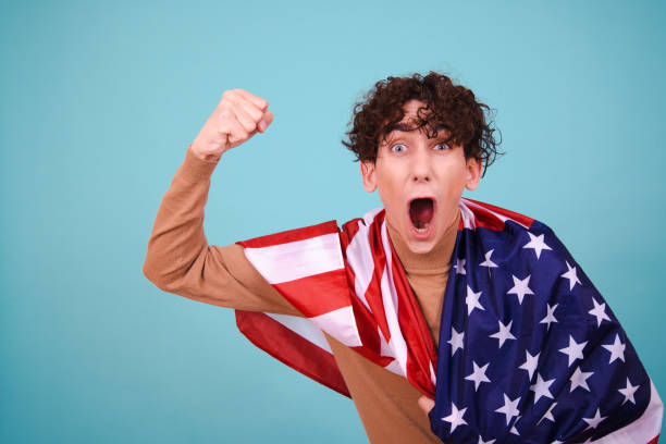 istock Young attractive guy with usa flag. 1600208477