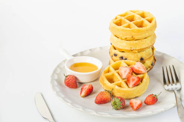 istock Round waffles on a white plate with strawberries 1600224961