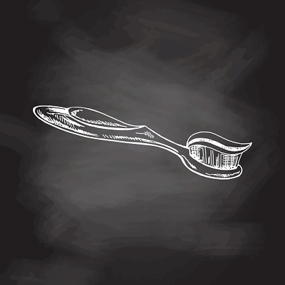 Hand drawn toothbrush doodle sketch isolated on chalkboard  background. Vector illustration. Toothache treatment.