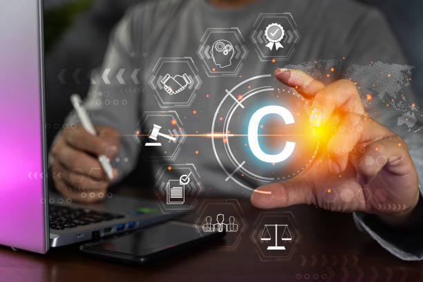 istock Copyright concept with person using a laptop computer. Patent law, intellectual property. 1600250519