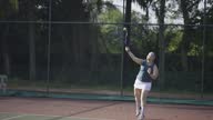 istock Asian Chinese female tennis player Serving The Ball practicing at tennis court 1600262169