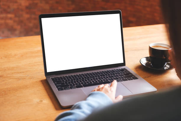 istock Mockup image of a woman using and working on laptop computer with blank white desktop screen while drinking coffee 1600282423