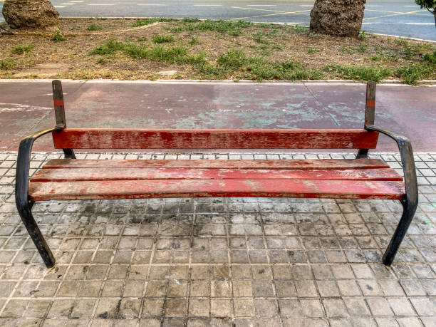 High angle view of broken wood bench in the street in the city of Valencia, Spain