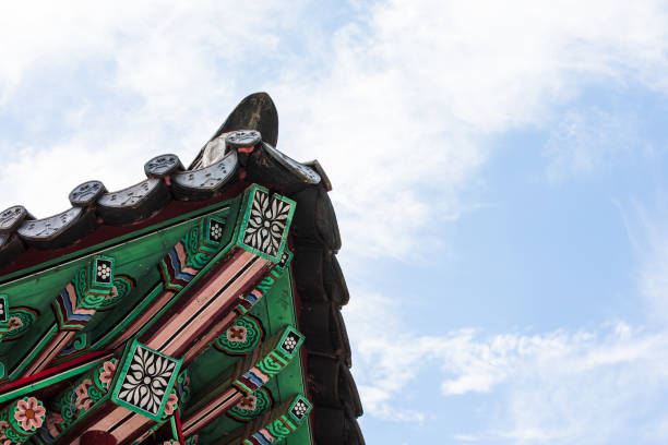 Korean traditional tiled roofs and colorful dancheong patterns. sunny day