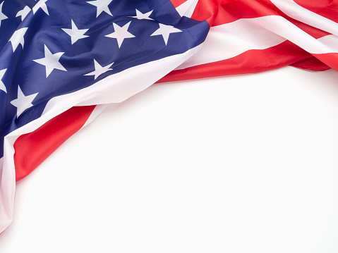 Top view of the American flag on a white background. Space for text Top view. Close-up photo