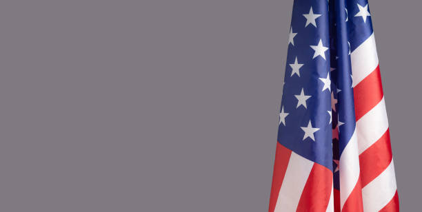 istock The American flag is on the right side on a gray background 1600328404