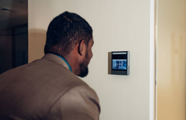istock Businessman using face scanner to unlock door in office, Biometric admittance control device for security system. 1600345550
