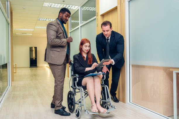 istock Professionals having a discussion, Successful business team working together in a co-working office. 1600355502