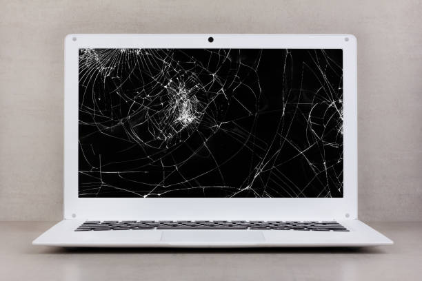 istock white laptop with a broken screen on a gray background close-up front view 1600360404