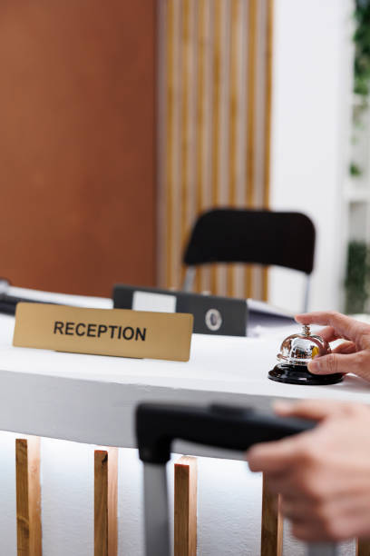 istock Traveler ringing service bell in lobby 1600375128