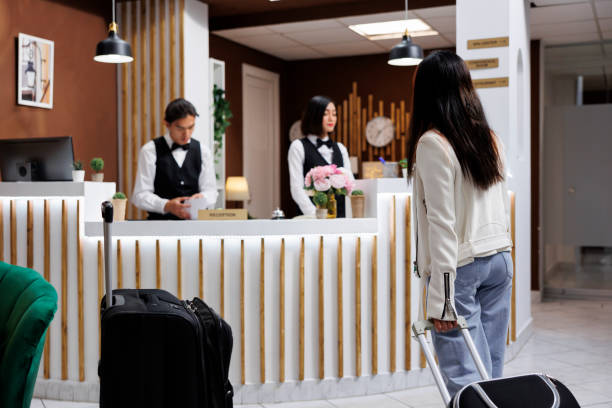 istock Customer holding luggage in lobby 1600393952