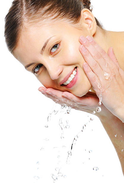 istock beauty happy female wash her face 160042267