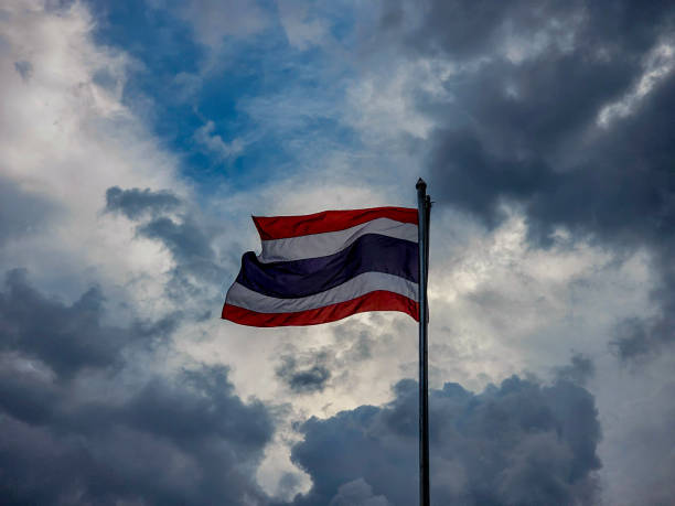 istock Thai national flag and cloudy sky 1600423361