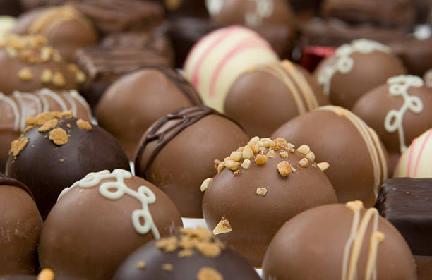 istock lots of chocolate truffles - focus on front 160042510