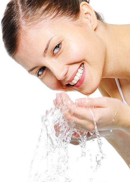 istock Happy beautiful woman wash her face 160042753