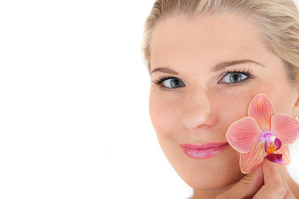 Young girl with flower stock photo