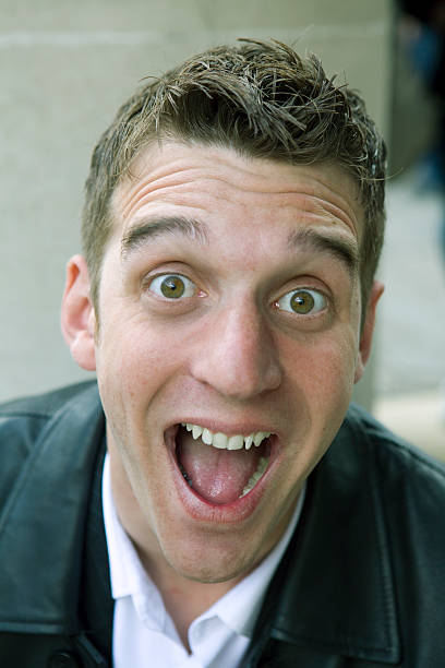 istock portrait of shouting happy funny man 160043633