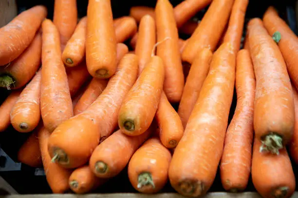 Photo of Crate of carrots in a farm shop