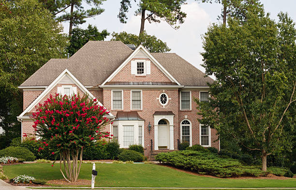 istock Traditional Brick Home with Blooming Crepe Myrtle 160045791
