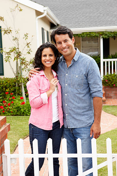 istock Hispanic couple outside new home 160047784