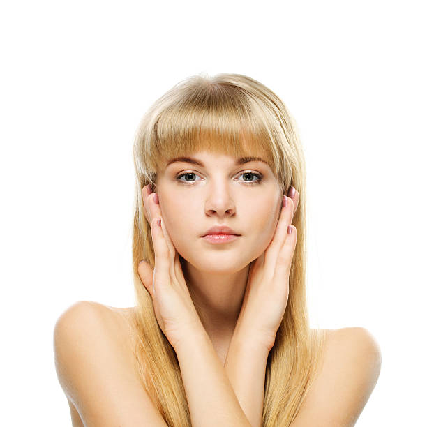 portrait of young blonde against white background stock photo