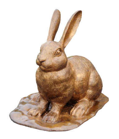 gold rabbit sculpture isolated