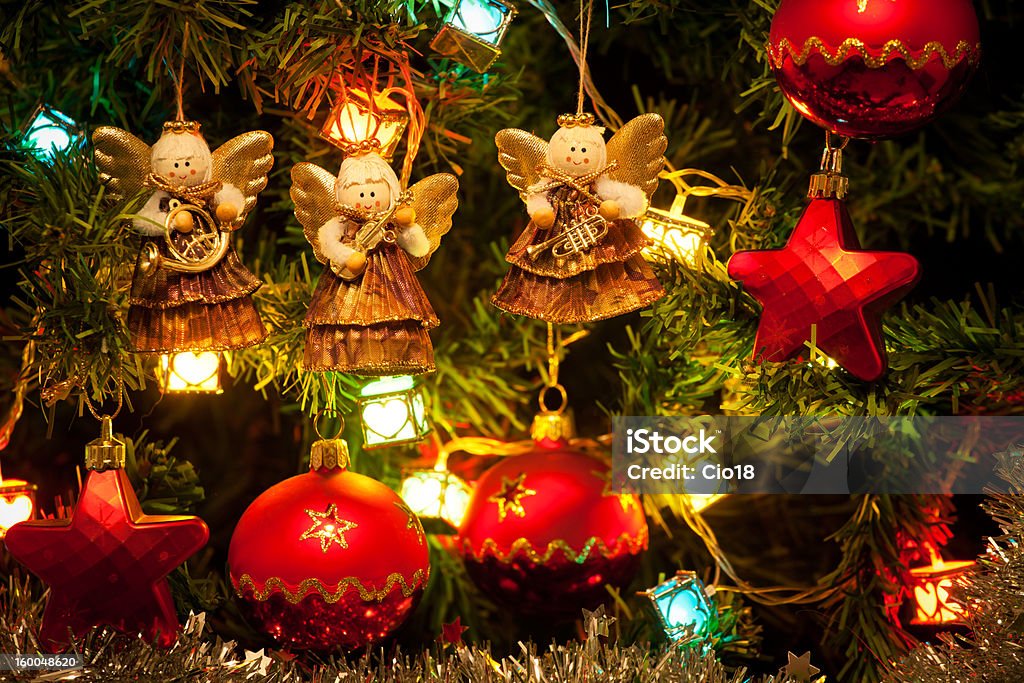 Musician angels hanging on the Christmas tree Christmas background, close up Angel Stock Photo