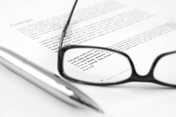 Small Print Contract with small print in focus (B&W, shallow DOF) read the fine print stock pictures, royalty-free photos & images