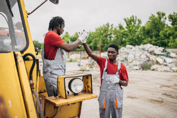 istock Two male workers talking at the recycling center 1600492726