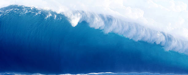istock Large Blue Surfing Wave Breaks in the Ocean 160050529