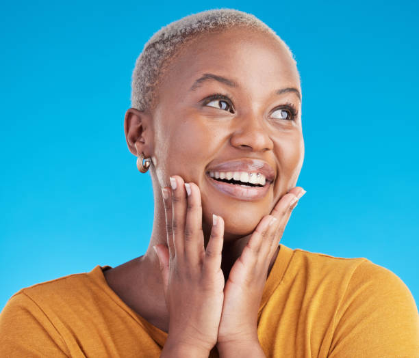 istock Thinking, inspiration and black woman with ideas, happiness and solution on a blue studio background. Person, excited and model with problem solving, decision and choice with mindset for planning 1600507118