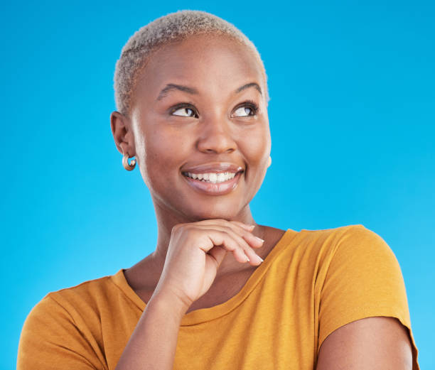 istock Thinking, idea or black woman with inspiration, opportunity or brainstorming on a blue studio background. Person, happiness or model with problem solving, decision or choice with planning or solution 1600507651