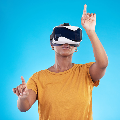 Black woman, press on screen  and virtual reality, future technology and 3D on blue background. User experience, VR goggles and female person, digital world and  video game in studio
