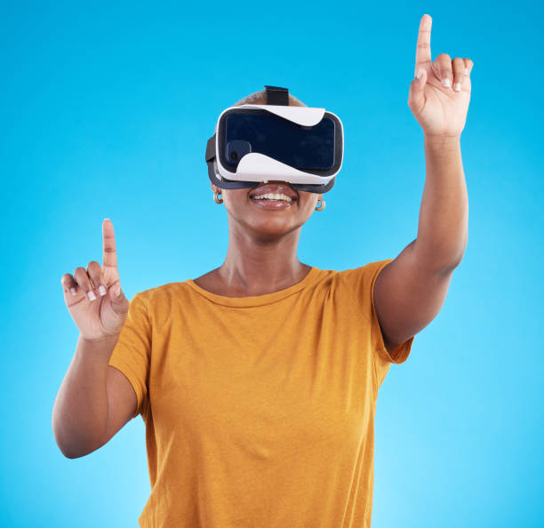 istock Black woman,  screen with future technology and 3D on blue background. User experience, VR goggles and female person press, digital world and gaming software in studio 1600508196