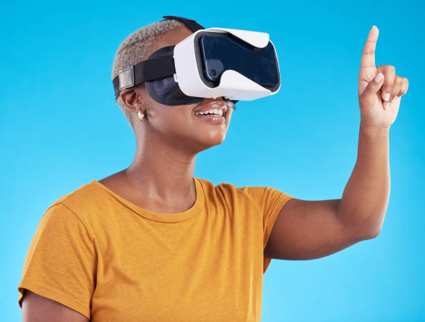 istock Black woman, touch screen with future technology and 3D on blue background. User experience, VR goggles and female person, digital world and  gaming software in studio 1600508198